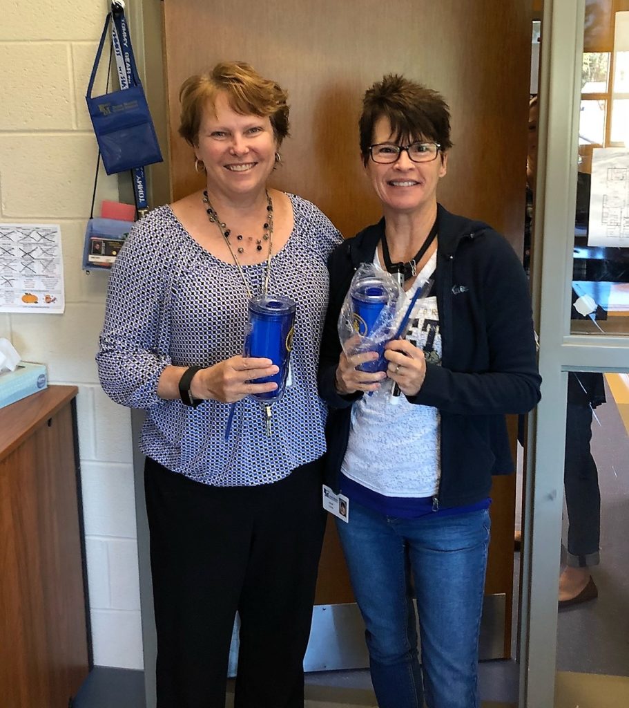 Employees with tumblers