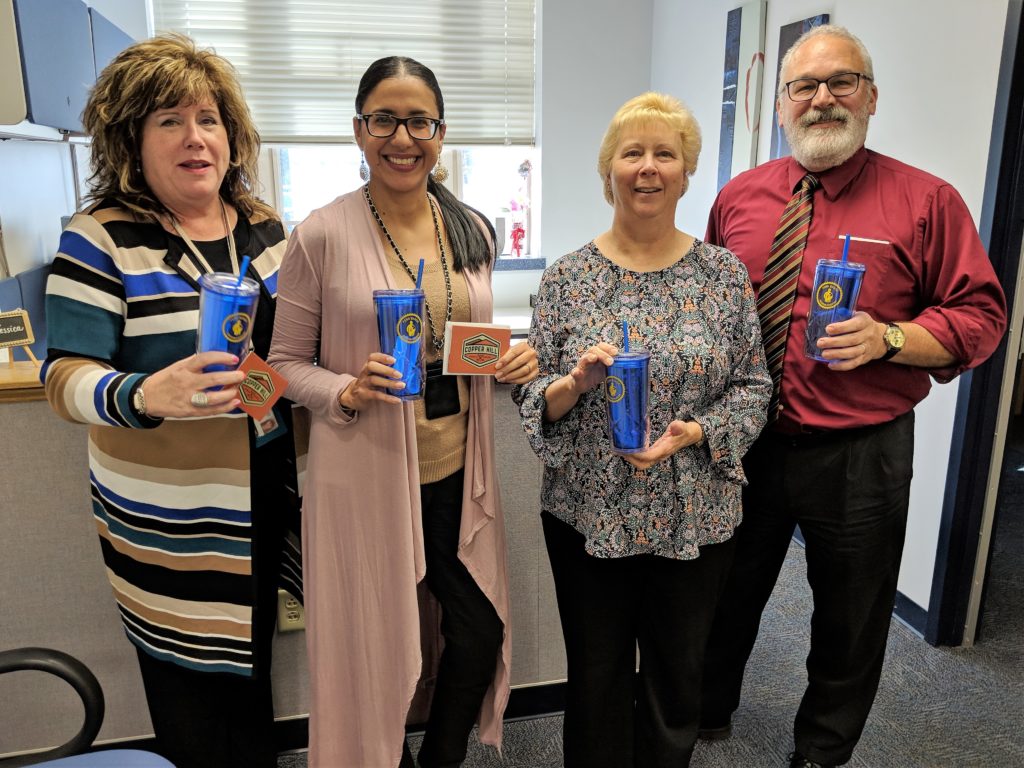 Employees with tumblers