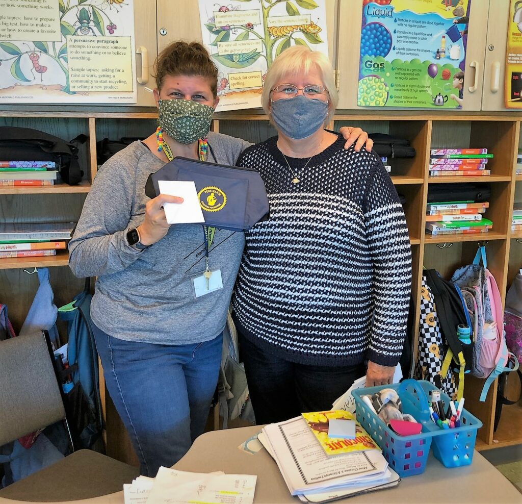 Teachers posing with PMEF cooler bags