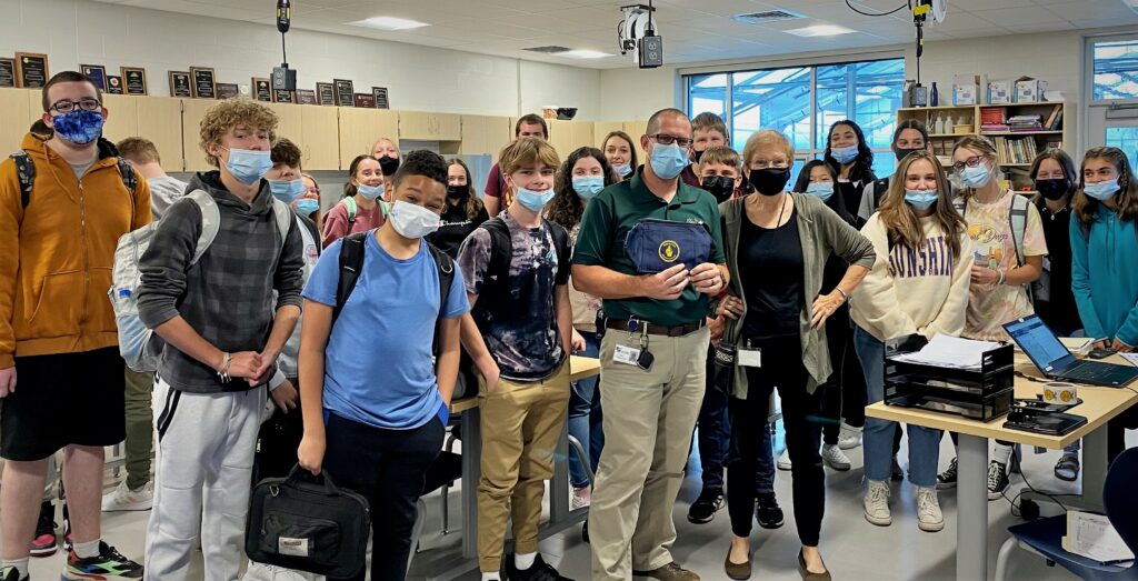 Teachers posing with PMEF cooler bags
