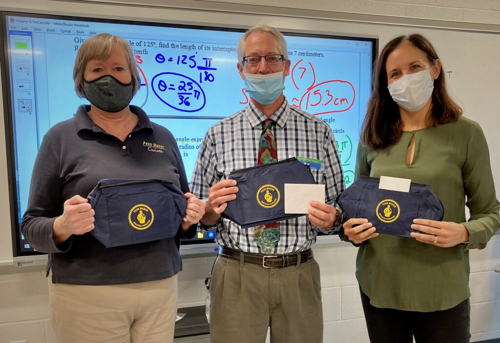 Teachers posing with PMEF cooler bags