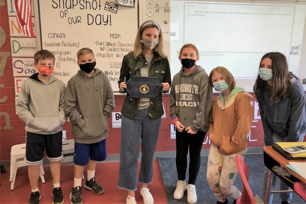 Teachers posing with PMEF cooler bags